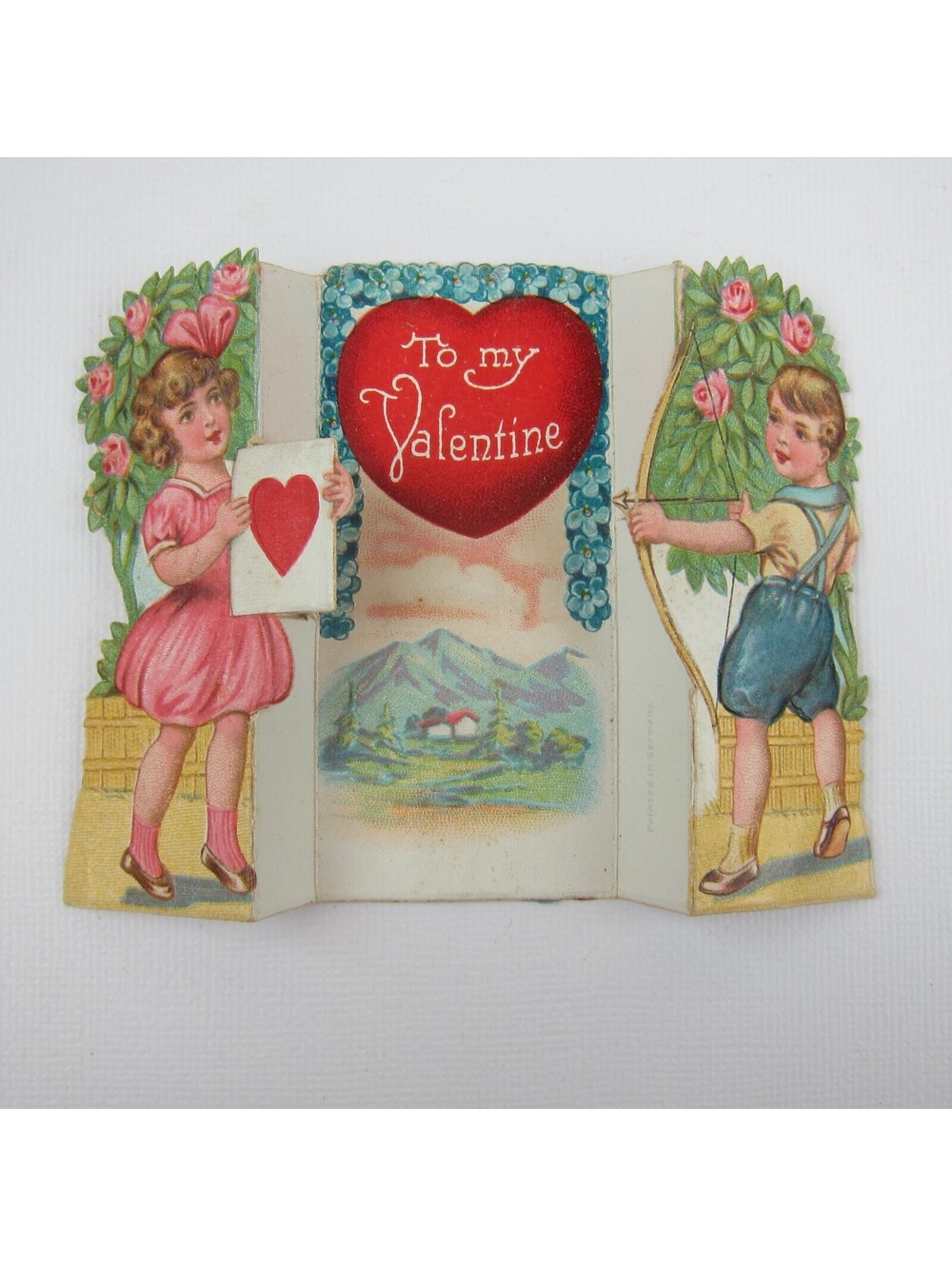 Vintage Valentine Boy Shoots Arrow Girl Pink Dress Holds Heart Target Mountains
